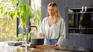 woman-making-pasta-boiling-water