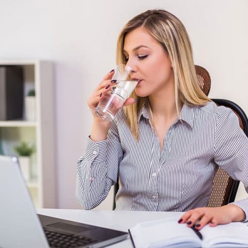woman-drinking-water-office woman-drinking-water-office